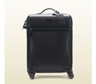 Gucci four wheel carry-on suitcase