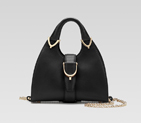 gucci stirrup top handle bag with spur detail