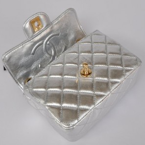 Chanel 1115 mini Classic Flap Bag Sheepskin Leather light silver in Gold